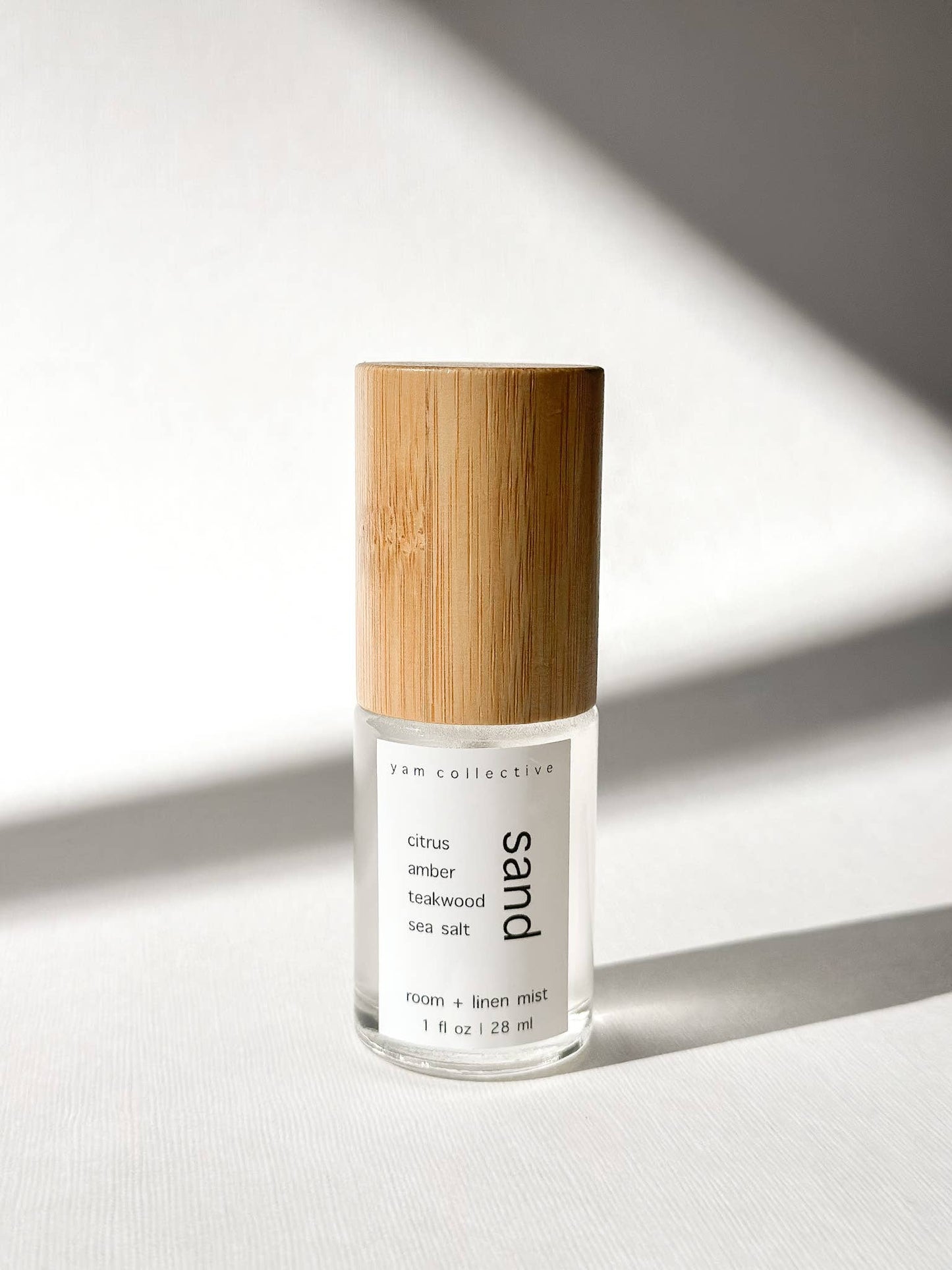 Sand- 1 oz citrus, amber, teakwood, sea room + linen mist